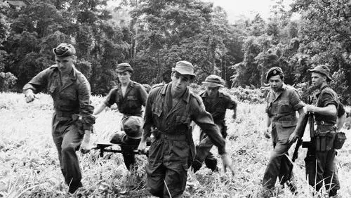 cd events the malayan emergency 1948 1960 men of 22 special air service regiment practice carrying a casualty to a waiting helicopter during a training exercise in a jungle 
